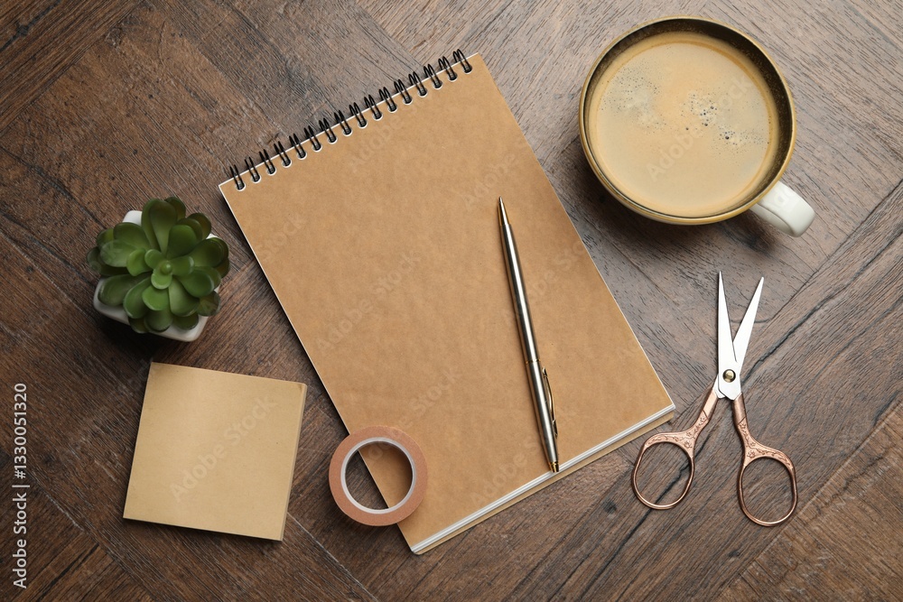 Φωτογραφία Different stationery, cup of coffee and houseplant on wooden table, flat lay