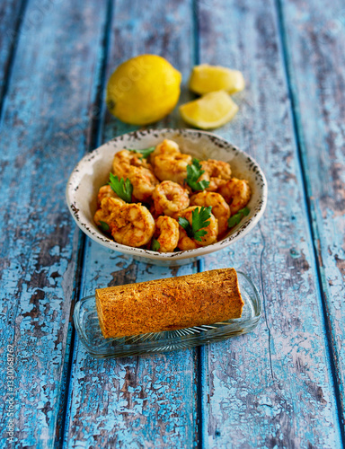 sautéed shrimp with a Cajun compound butter and fresh lemon