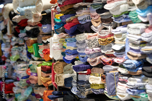 Obraz na płótnie Retail shop is filled with stacks of high-quality fabrics and textiles, providing customers with an extensive selection of materials for their projects. w salonie