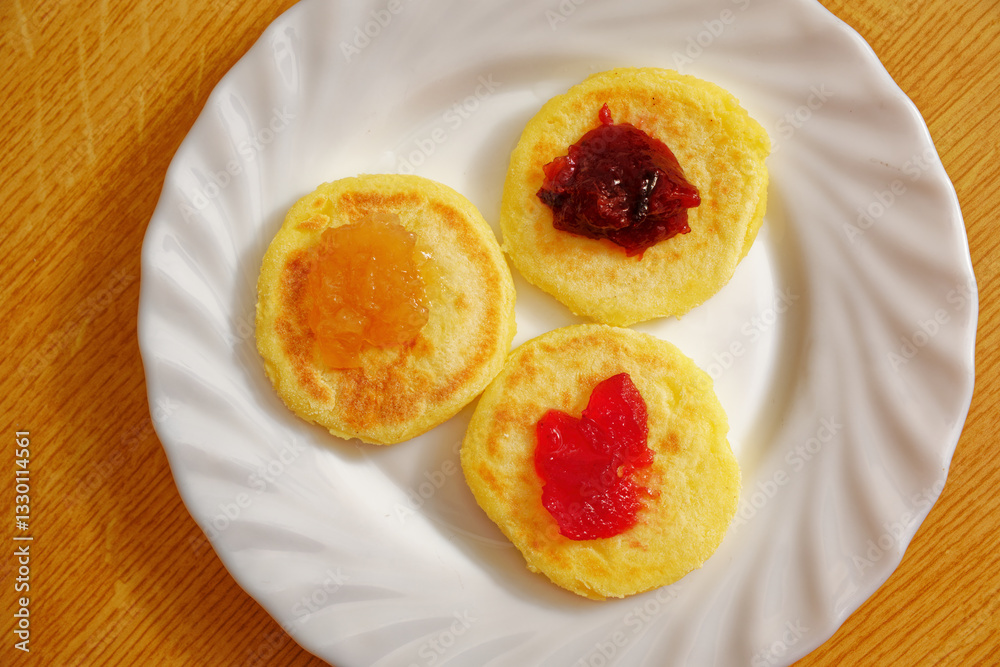 Potato dough patties with jam top view