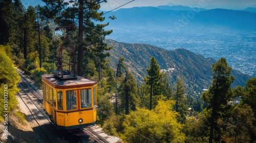 Vintage yellow funicular ascending scenic mountain in angeles national forest. Charming yellow funicular climbs a mountainside amidst lush greenery, offering breathtaking views of the angeles national