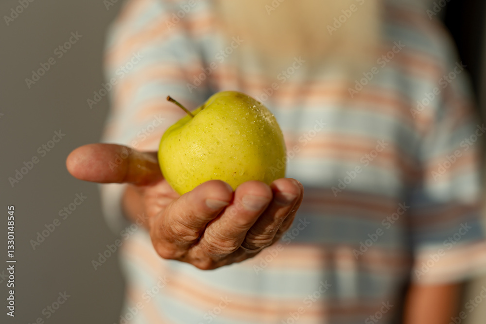 Aging Gracefully: Embracing Nature's Bounty with a Fresh Apple in Hand Aging Gracefully: Embracing Nature's Bounty with a Fresh Apple in Hand