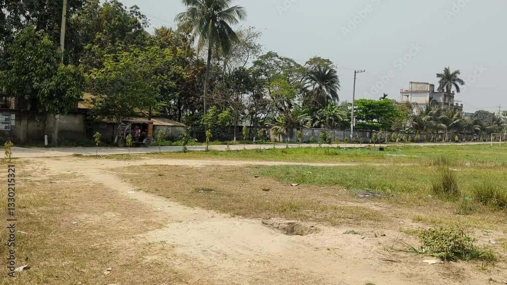Spacious Green Field for Sports and Relaxation with Clear Blue Sky Spacious Green Field for Sports and Relaxation with Clear Blue Sky