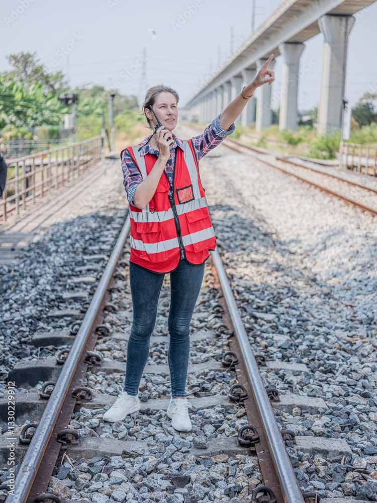 Construction workers' radio or walkie-talkie to talk communication for project management, planning or communication via tablet. Architects, contractors or engineering professionals are happy