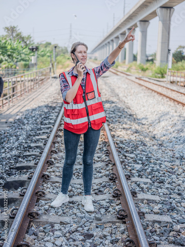 Obraz na płótnie Construction workers' radio or walkie-talkie to talk communication for project management, planning or communication via tablet. Architects, contractors or engineering professionals are happy w salonie