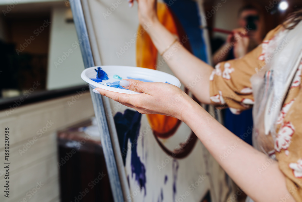 Obraz premium Process of drawing, group class of talented female students with painting easels and canvases during workshop lesson of watercolour painting indoors, drawing class for adult artists in art school