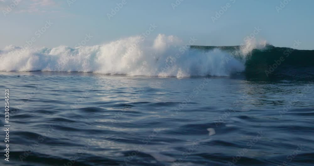 Woman surfer rides on the huge wave. Beautiful surfer girl during surfing fall from surfboard Woman surfer rides on the huge wave. Beautiful surfer girl during surfing fall from surfboard