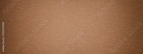 Texture of brown vintage paper gradient background with dark vignette. Structure of craft umber cardboard photo