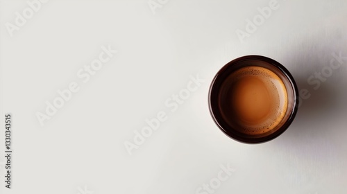 black coffee in a coffee cup top view isolated