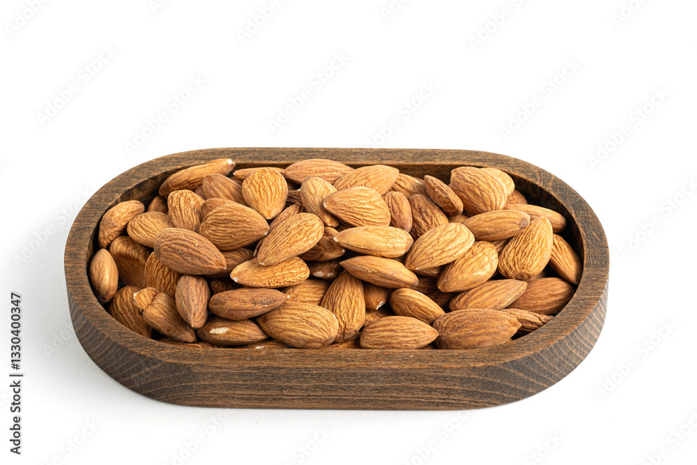 Almond in wooden bowl isolated on white background. Top view. Almond in wooden bowl isolated on white background. Top view.