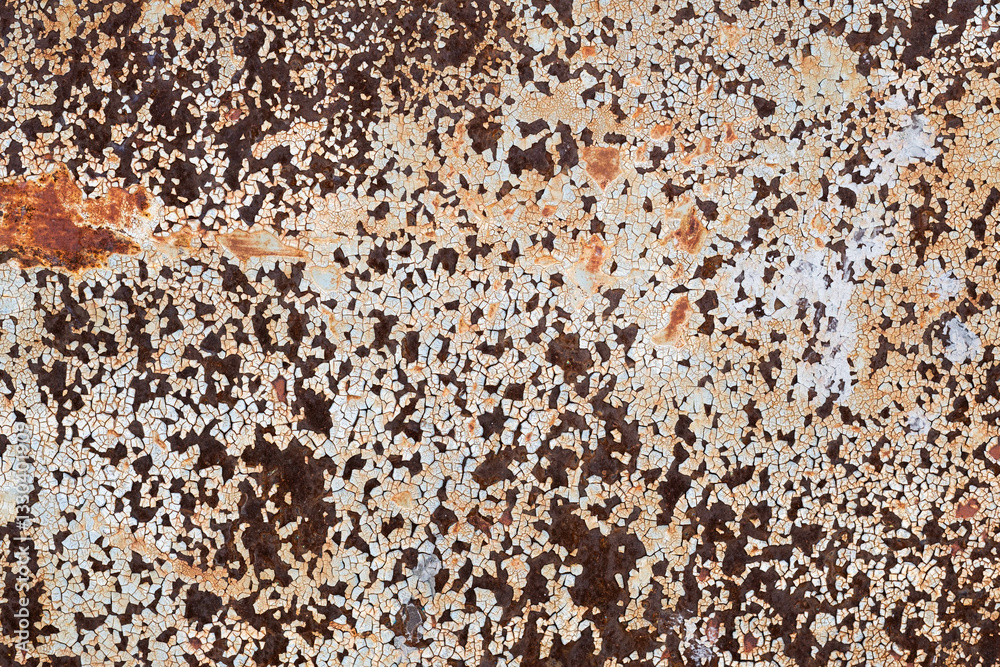 Texture of rusty metal. Background is made rusty metal with peeling white paint. Texture of rusty metal. Background is made rusty metal with peeling white paint.