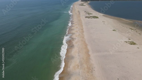 deserted wild ocean beach of Assotigue Island. Protected deserted area from a bird's eye view.

