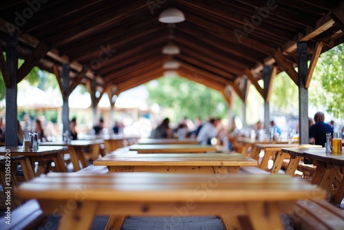 Group of people enjoying food and company under a shaded area