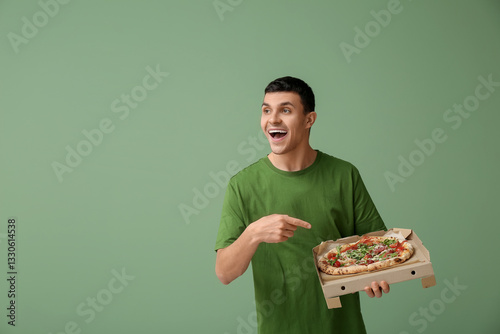 Young man pointing at cardb...