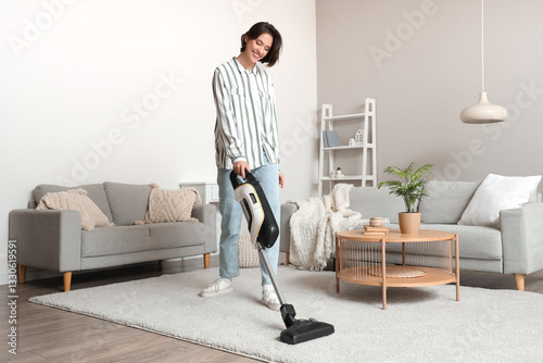 Happy young woman cleaning ...