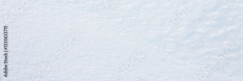 Obraz na płótnie Natural snow texture. Smooth surface of clean fresh snow. Snowy ground. Winter background with snow patterns. Closeup top view. Wide panoramic texture for background and design. w salonie