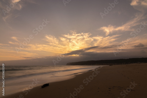 A solas en la playa al atardecer photo