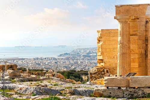 View of the Aegean sea, the seaside town of Palaio Faliro and the Piraeus Port from the Propylaea Gate near the Parthenon on Acropolis Hill, Athens, Greece. photo