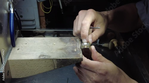 Close-up, jewelry processing, close-up polishing, factory worker processing jewelry, jewelry factory