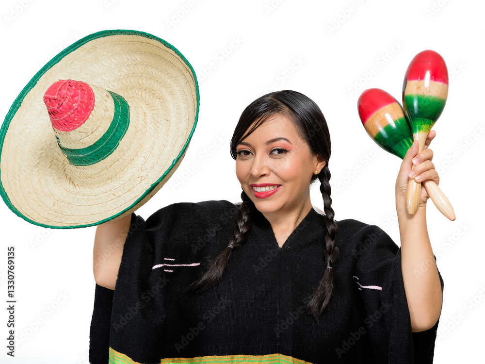 Fototapeta premium Smiling Mexican woman wearing colorful poncho and hat plays maracas, isolated on white background