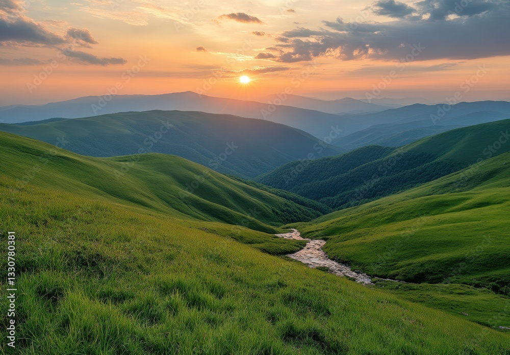 Naklejka premium Serene Sunset Over Rolling Green Hills with Gentle Stream Flowing Through Lush Valleys and Majestic Mountains in the Background