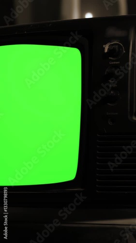 Remote Turns On Old TV with Green Screen - Lateral Dolly - Close-Up - Vertical 4K