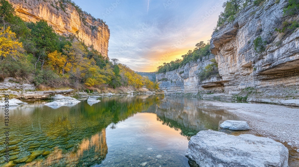 Calm river flowing between large cliffs at sunset Calm river flowing between large cliffs at sunset