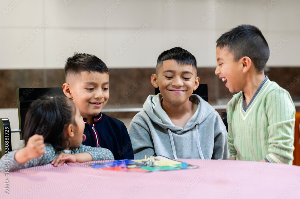 Happy kids playing board game and having fun together at home Happy kids playing board game and having fun together at home