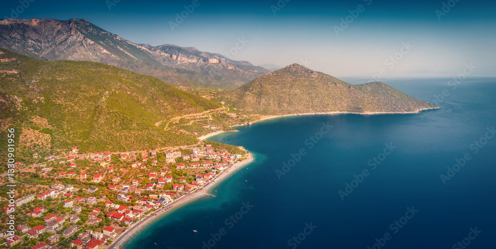 Colorful summer view from flying drone of Tyros - old naval town in Arcadia. Wonderful morning seascape of Myrtoan Sea. Aerial outdoor scene of Peloponnese peninsula, Greece, Europe.