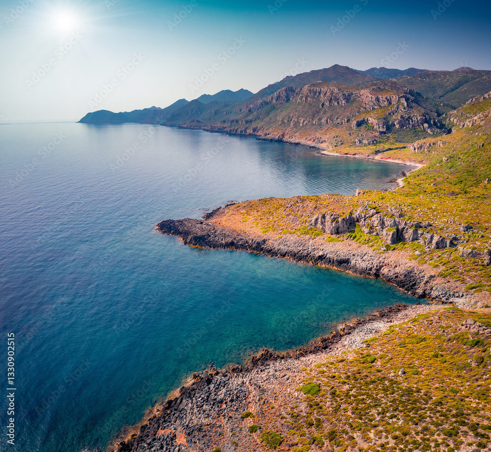 Colorful summer view from flying drone of rocky coast of Greece. Wonderful outdoor scene of Peloponnese peninsula with deep blue sky, Greece. Beautiful summer seascape of Mediterranean Sea.