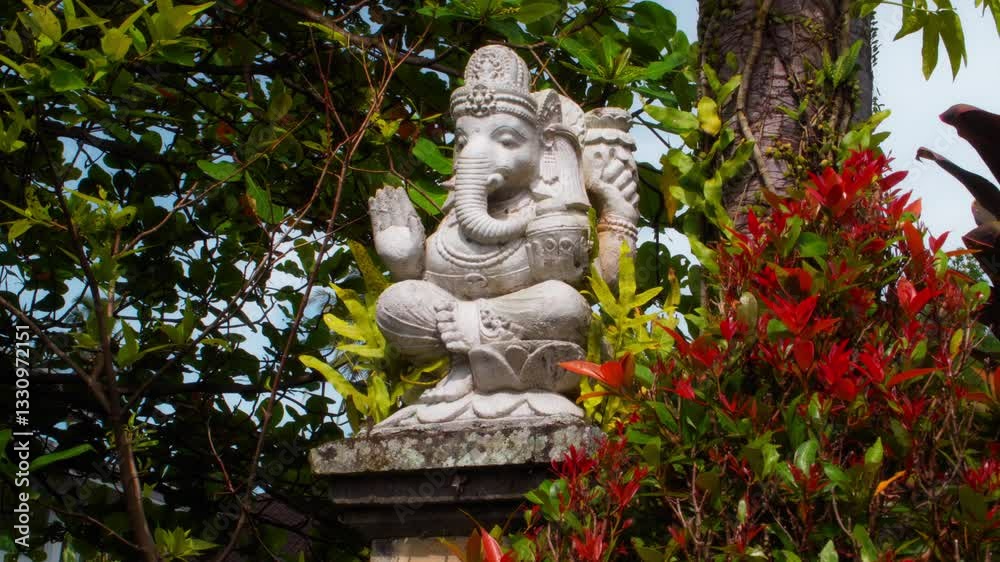 An old stone statue of Ganesha covered with moss. An old stone statue of Ganesha covered with moss.