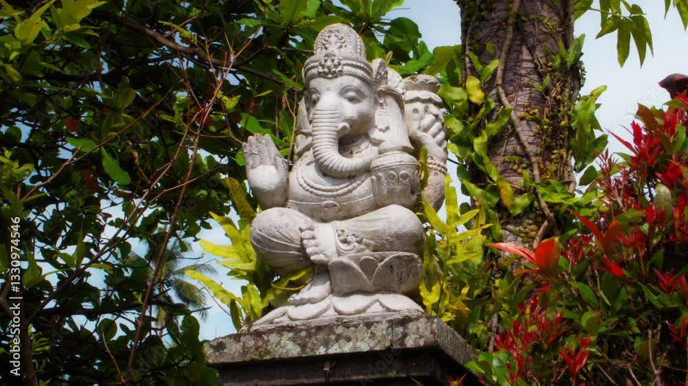 An old stone statue of Ganesha covered with moss. An old stone statue of Ganesha covered with moss.
