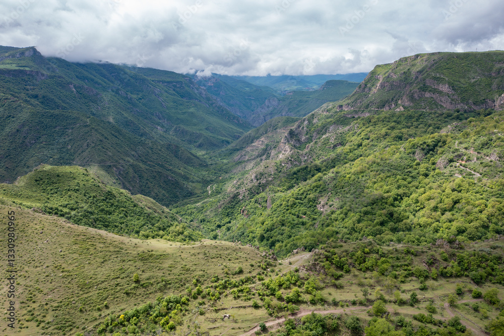 Aerial drone photo of Vorotan River Canyon near Tatev monastery stretched until Goris, the deepest canyon in Armenia, a popular travel and hiking destination with dramatic landscapes and lush greenery Aerial drone photo of Vorotan River Canyon near Tatev monastery stretched until Goris, the deepest canyon in Armenia, a popular travel and hiking destination with dramatic landscapes and lush greenery
