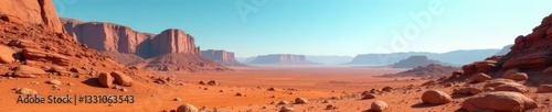 Rocky formations jut from rusty red soil against a blue sky on Mars, red, rocky