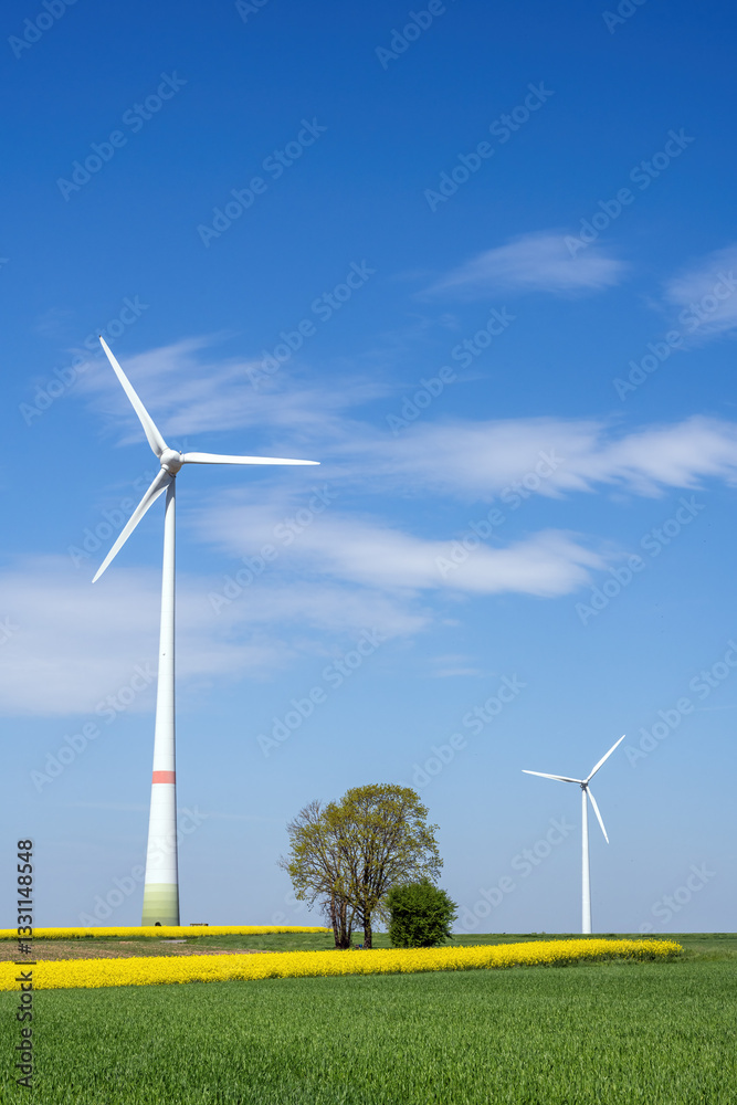 Modern wind energy plants with an agricultural landscape seen in Germany Modern wind energy plants with an agricultural landscape seen in Germany