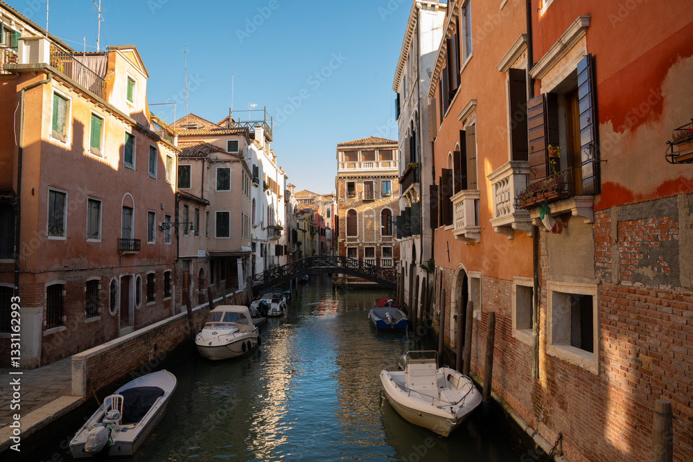 Sunlit Canal with Historic Buildings in Venice, Italy
Sunlit Canal with Historic Buildings in Venice, Italy