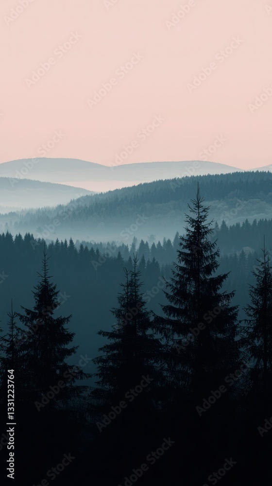 Obraz premium Misty mountain layers with evergreen trees under a soft pastel sky
