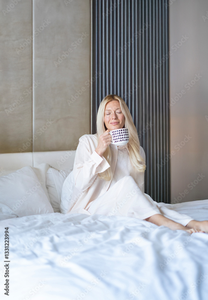 Joyful Morning Retreat: Young Woman in Bathrobe Sipping Steaming Coffee in Modern Hotel Room smiling Joyful Morning Retreat: Young Woman in Bathrobe Sipping Steaming Coffee in Modern Hotel Room smiling