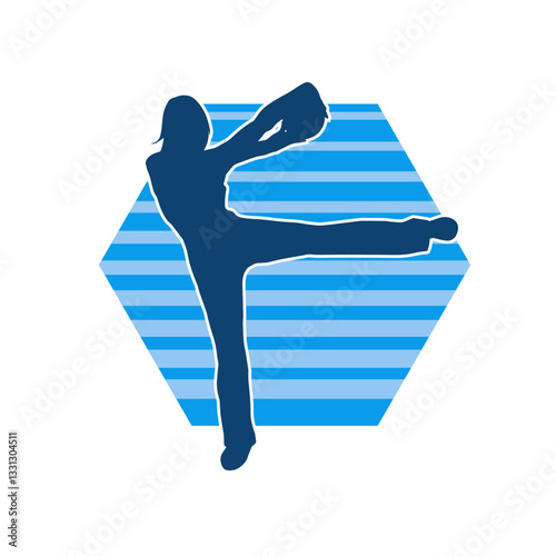 Silhouette of a slim sporty woman doing stretching exercise using gym ball. Silhouette of a sporty female doing physical workout using fitness ball. 