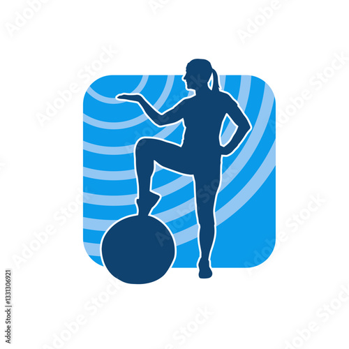 Silhouette of a slim sporty woman doing stretching exercise using gym ball. Silhouette of a sporty female doing physical workout using fitness ball. 