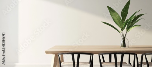 A table with a vase of flowers in the center and black chairs surrounding it photo