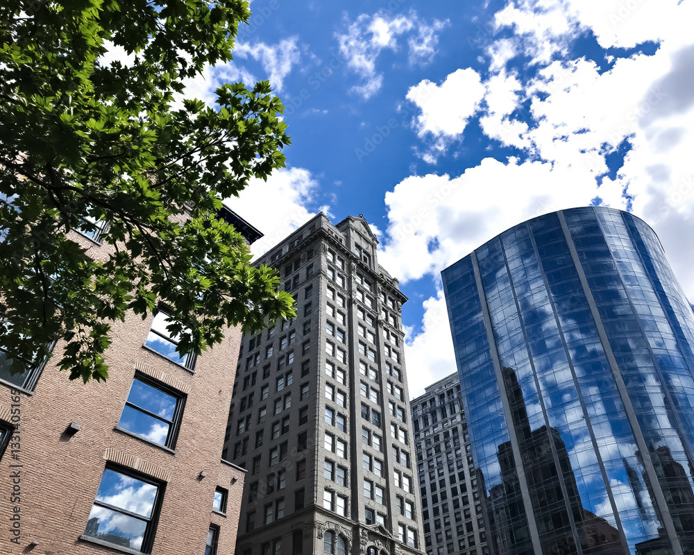 three buildings of different architectural styles against a bright summer sky three buildings of different architectural styles against a bright summer sky