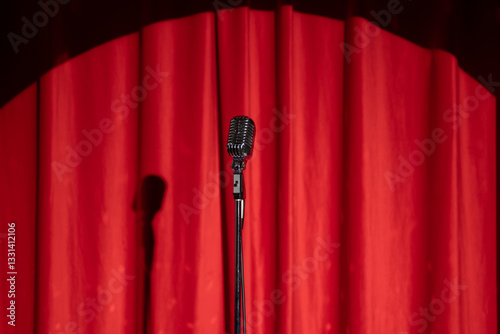 Concept stand up, comedian show banner. Old microphone on theater stage on red curtains background
