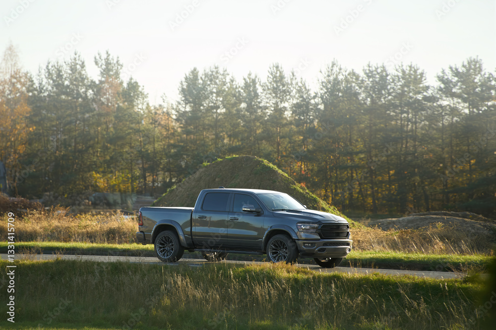 Fototapeta premium Fast pickup truck driving on open road