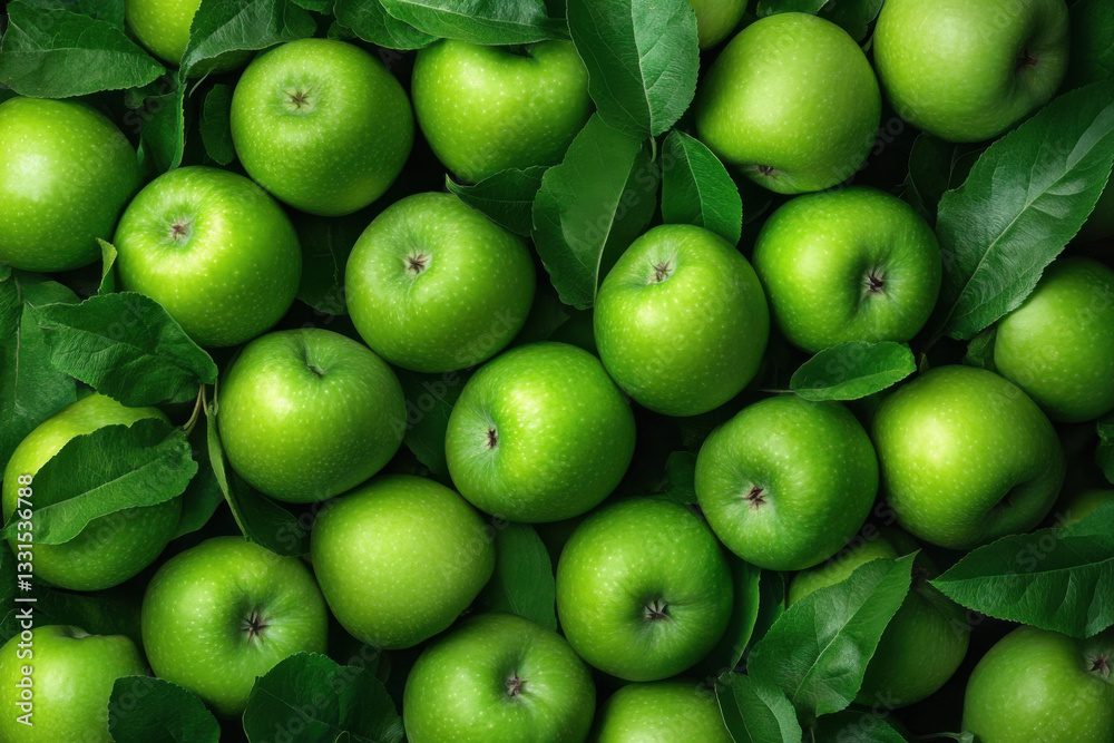 Fresh green apples forming a vibrant background with leaves Fresh green apples forming a vibrant background with leaves
