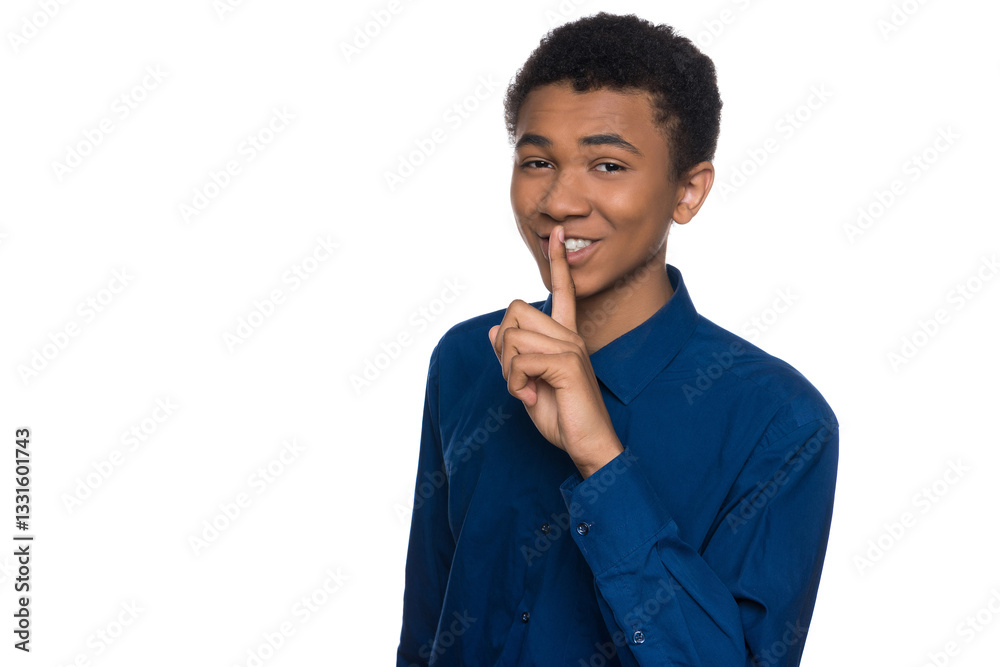 African American teen shows silence gesture. African American teen shows silence gesture.
