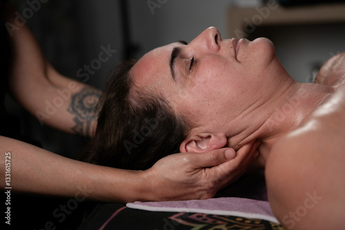 masseur exerting finger pressure on the neck