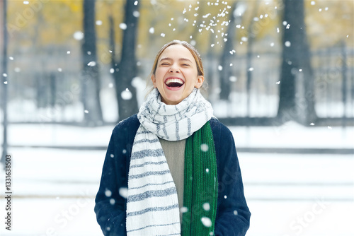 Exuberant young woman laughing heartily in a winter landscape, capturing the pure joy and infectious happiness of embracing the snowy season. photo