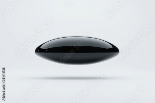 Sleek black shape hovers above minimalistic background, exuding