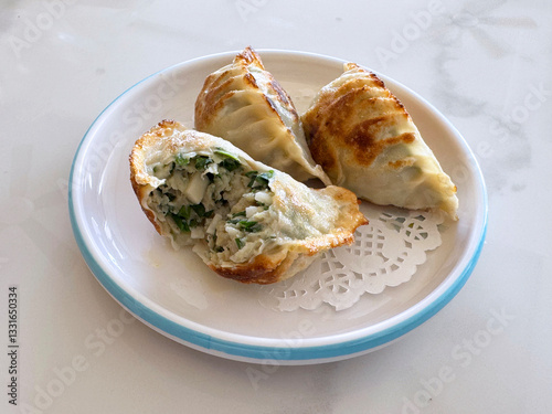 Obraz na płótnie deep fried crispy Xiao long bao Shanghai small meat dumpling wanton jiao zhi in plate with ginger vinegar on white background dim sum halal food breakfast menu for china Hong Kong cafe w salonie